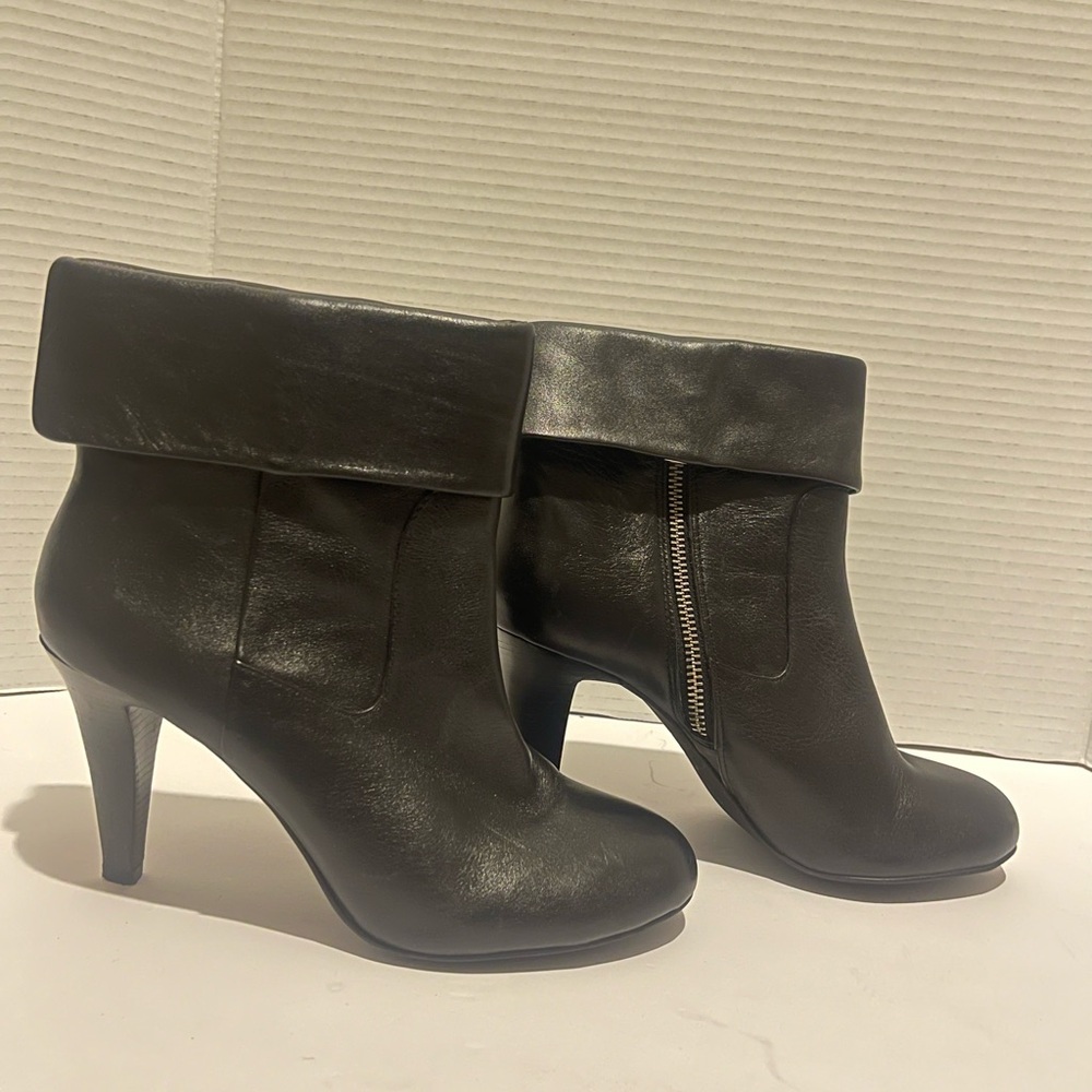 Michael Kors black zip boots.